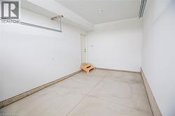 Unfurnished room with concrete flooring - 