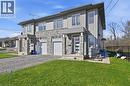 Modern home with an attached garage, driveway, a front yard, and stone siding - 40 Pietz Avenue, Welland, ON  - Outdoor 