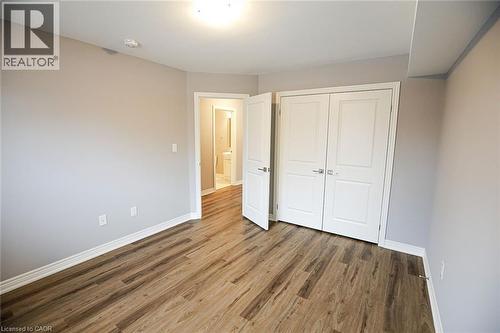 Unfurnished bedroom with wood finished floors and a closet - 40 Pietz Avenue, Welland, ON - Indoor Photo Showing Other Room