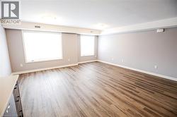 Empty room with light wood finished floors and baseboards - 