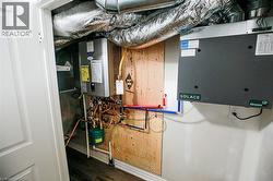 Utility room featuring water heater - 
