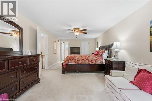 Bedroom with light carpet and ceiling fan - 668 Tomahawk Crescent, Ancaster, ON - Indoor Photo Showing Bedroom