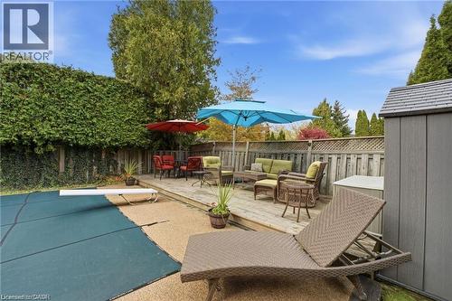 Fenced backyard featuring a wooden deck and an outdoor lounge area - 668 Tomahawk Crescent, Ancaster, ON - Outdoor With Deck Patio Veranda