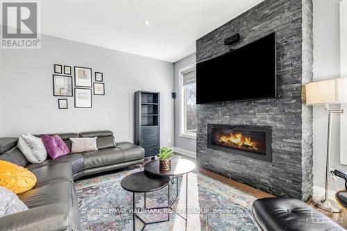 Floor to ceiling fireplace. - 250 Richardson Avenue, Ottawa, ON - Indoor Photo Showing Living Room With Fireplace