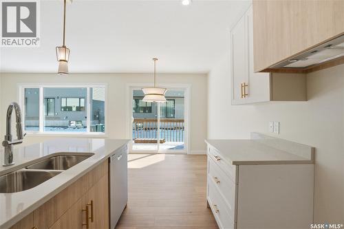 404 155 Mcfaull Way, Saskatoon, SK - Indoor Photo Showing Kitchen With Double Sink