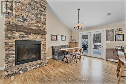 48 Tall Pines Drive, Tiny, ON - Indoor Photo Showing Other Room With Fireplace