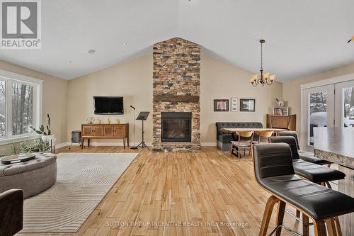 48 Tall Pines Drive, Tiny, ON - Indoor Photo Showing Living Room With Fireplace