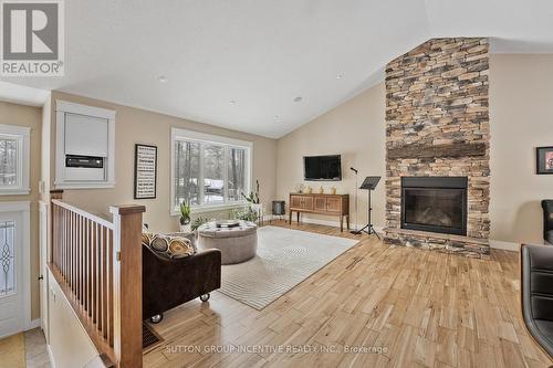 48 Tall Pines Drive, Tiny, ON - Indoor Photo Showing Living Room With Fireplace