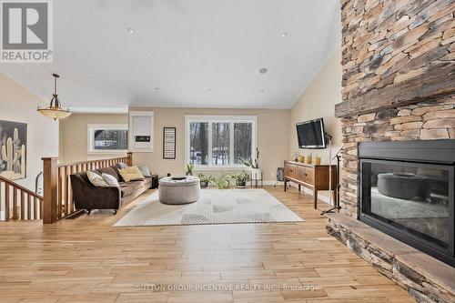 48 Tall Pines Drive, Tiny, ON - Indoor Photo Showing Living Room With Fireplace