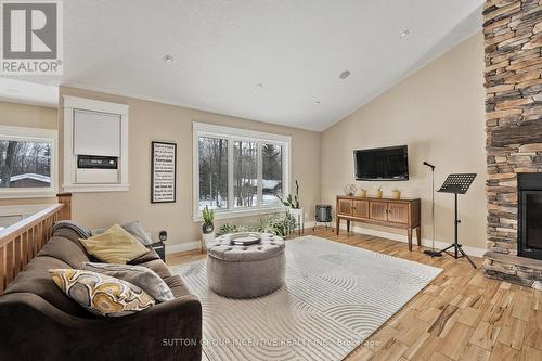 48 Tall Pines Drive, Tiny, ON - Indoor Photo Showing Living Room With Fireplace
