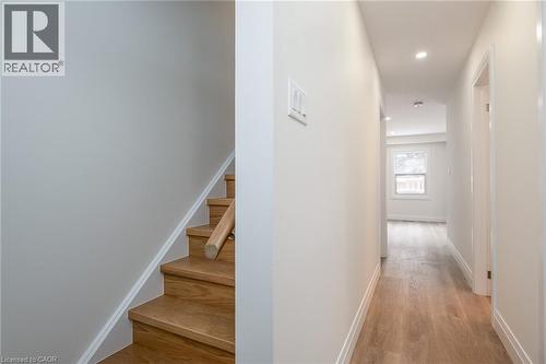 Corridor with light wood-style flooring and recessed lighting - 27 Queenston Drive, Kitchener, ON - Indoor Photo Showing Other Room