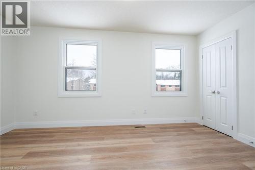 Unfurnished bedroom with light wood finished floors and a closet - 27 Queenston Drive, Kitchener, ON - Indoor Photo Showing Other Room