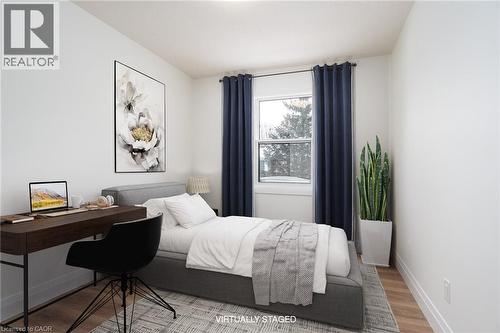Bedroom featuring baseboards and wood finished floors - 27 Queenston Drive, Kitchener, ON - Indoor Photo Showing Bedroom