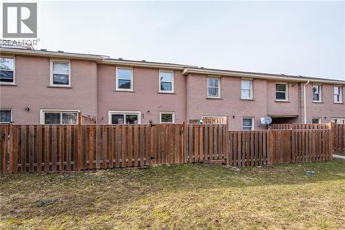 View of fenced yard - 27 Queenston Drive, Kitchener, ON - Outdoor With Exterior