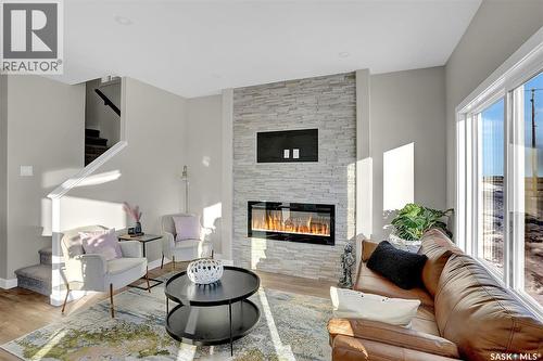 230 Kostiuk Crescent, Saskatoon, SK - Indoor Photo Showing Living Room With Fireplace