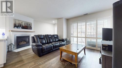 419 - 1400 The Esplanade North W, Pickering, ON - Indoor Photo Showing Living Room With Fireplace