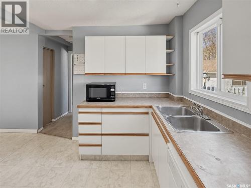 619 4Th Avenue Nw, Swift Current, SK - Indoor Photo Showing Kitchen With Double Sink