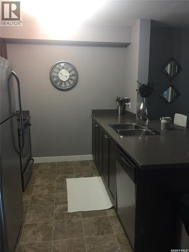 205 820 5Th Street Ne, Weyburn, SK - Indoor Photo Showing Kitchen With Double Sink