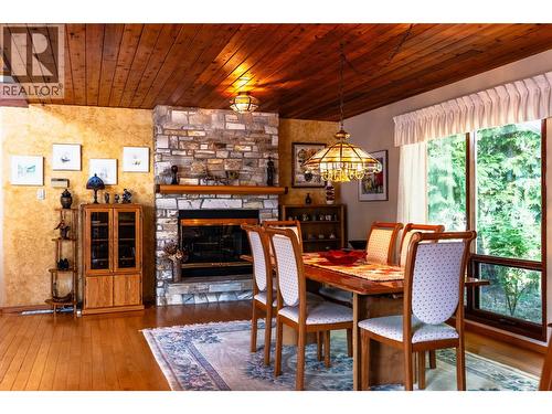 1896 3A Highway, Nelson, BC - Indoor Photo Showing Dining Room With Fireplace