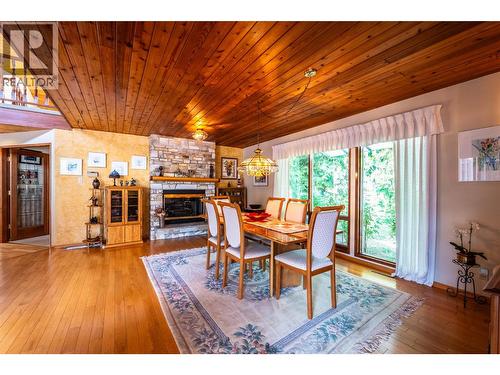 1896 3A Highway, Nelson, BC - Indoor Photo Showing Dining Room With Fireplace
