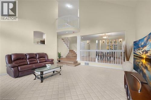 Living room featuring a high ceiling and carpet flooring - 90 Westlawn Drive, Hamilton, ON - Indoor