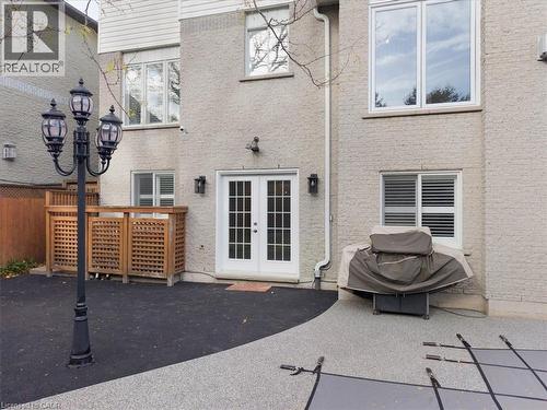Rear view of property with french doors, stucco siding, and a patio - 90 Westlawn Drive, Hamilton, ON - Outdoor With Exterior