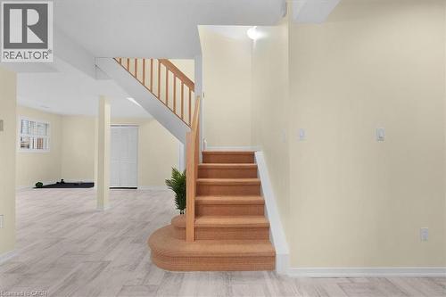 Stairway with baseboards and wood finished floors - 90 Westlawn Drive, Hamilton, ON - Indoor Photo Showing Other Room