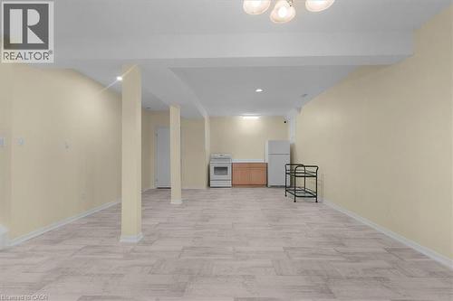 Finished below grade area featuring freestanding refrigerator and recessed lighting - 90 Westlawn Drive, Hamilton, ON - Indoor Photo Showing Other Room
