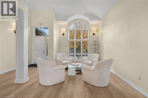 Sitting room with light wood finished floors, vaulted ceiling, and healthy amount of natural light - 90 Westlawn Drive, Hamilton, ON - Indoor