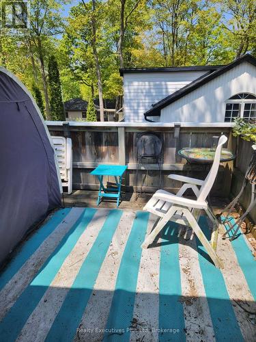 Balcony off Primary Bedr - 48 Tiny Beaches Road N, Tiny, ON - Outdoor With In Ground Pool