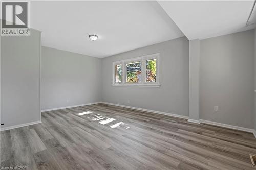 Empty room featuring baseboards and light wood-style floors - 40 Bertram Drive, Dundas, ON - Indoor Photo Showing Other Room