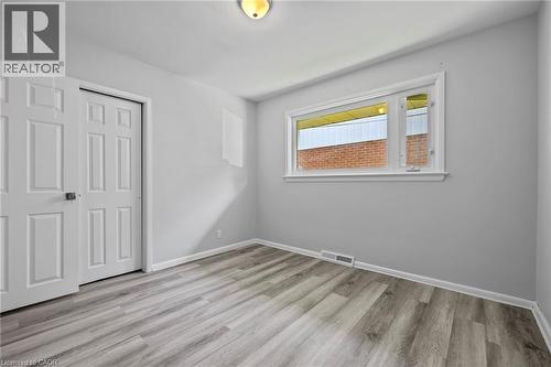 Unfurnished bedroom featuring light wood-type flooring and a closet - 40 Bertram Drive, Dundas, ON - Indoor Photo Showing Other Room