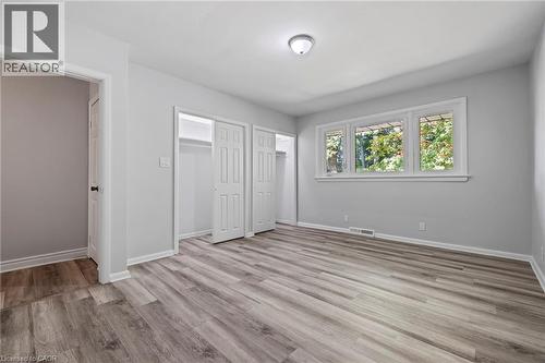 Unfurnished bedroom featuring multiple closets and light wood-style floors - 40 Bertram Drive, Dundas, ON - Indoor Photo Showing Other Room