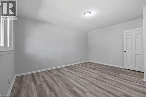 Unfurnished bedroom with light wood-type flooring and baseboards - 40 Bertram Drive, Dundas, ON - Indoor Photo Showing Other Room