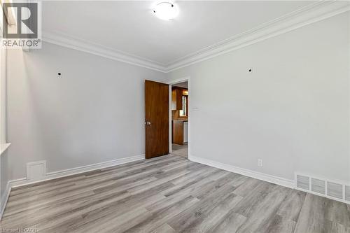 Spare room featuring ornamental molding and light wood finished floors - 40 Bertram Drive, Dundas, ON - Indoor Photo Showing Other Room