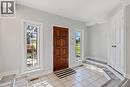 Foyer featuring light tile patterned flooring and plenty of natural light - 40 Bertram Drive, Dundas, ON  - Indoor Photo Showing Other Room 