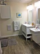 Bungalow bathroom has two vanities - 