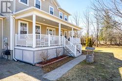 Classic front veranda designed for summer lounging - 