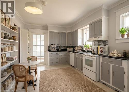Virtually staged to provide a visual sense of space and proportion - 33 Main Street E, Drayton, ON - Indoor Photo Showing Kitchen