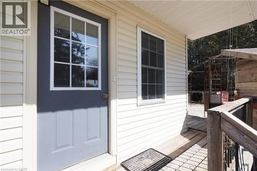 View of exterior entry from backyard deck - 33 Main Street E, Drayton, ON - Outdoor With Exterior