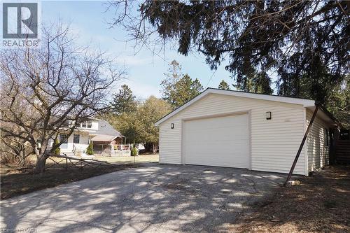 Detached garage featuring asphalt driveway - 33 Main Street E, Drayton, ON - Outdoor