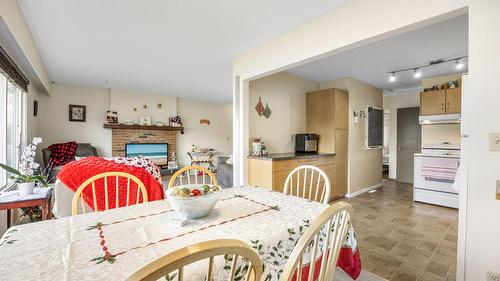 2429 Gosset Road, West Kelowna, BC - Indoor Photo Showing Dining Room With Fireplace
