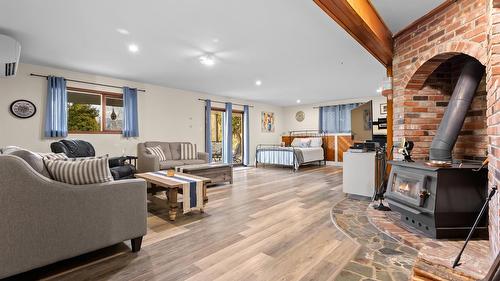 940 Peterman Road, Creston, BC - Indoor Photo Showing Other Room With Fireplace