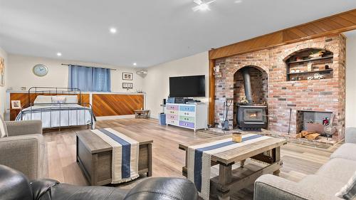 940 Peterman Road, Creston, BC - Indoor Photo Showing Living Room With Fireplace