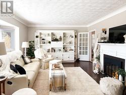 Large bright living room with fireplace hearth - 