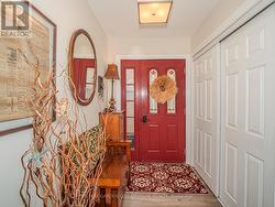 Interior inlaw entrance foyer with double closet - 
