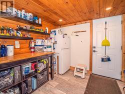 Workshop in barn showing man door entrance - 