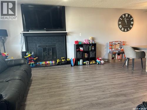488 Willow Bay, Estevan, SK - Indoor Photo Showing Living Room With Fireplace