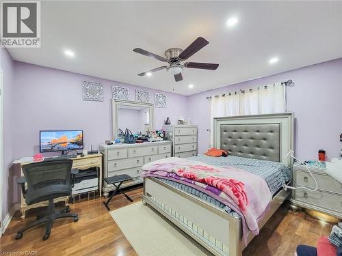Bedroom featuring wood finished floors, a desk, ceiling fan, and recessed lighting - 823 Queensdale Avenue E, Hamilton, ON - Indoor Photo Showing Bedroom
