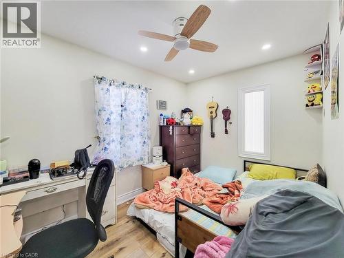 Bedroom featuring hardwood / wood-style floors, an office area, recessed lighting, and ceiling fan - 823 Queensdale Avenue E, Hamilton, ON - Indoor Photo Showing Bedroom